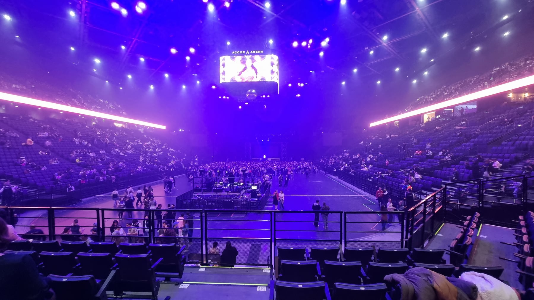 The interior of Accor Arena in Paris under purple lighting on 6 November 2025.