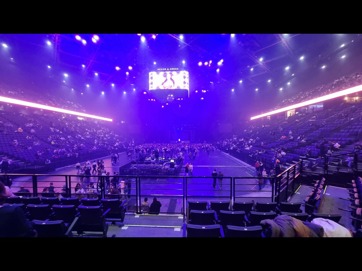 The interior of Accor Arena in Paris under purple lighting on 6 November 2025.