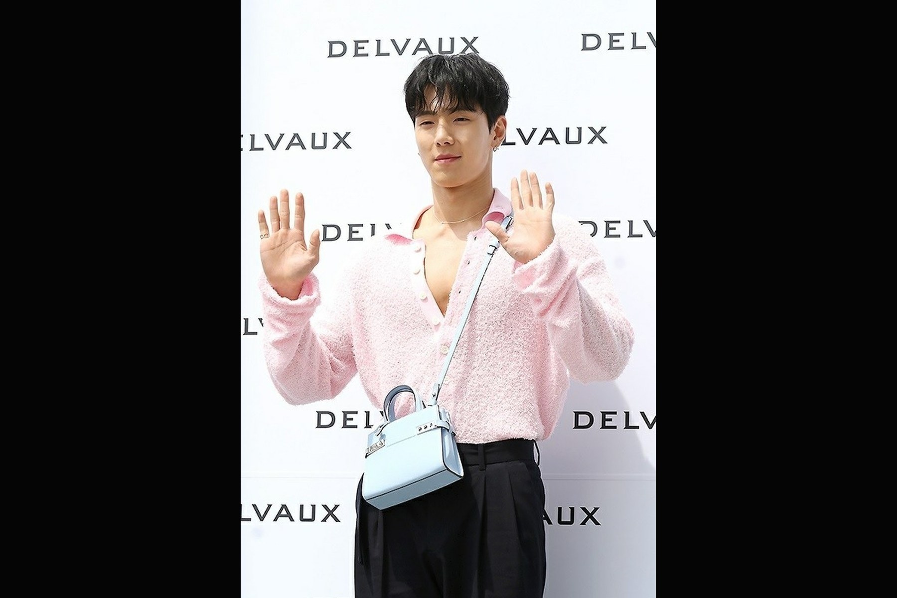 Paris Fashion Week 2026: Shownu and Hyungwon Are Confirmed for Concept Korea. Archive image: Shownu at a 2023 Delvaux event; not evidence of current Paris Fashion Week attendance.